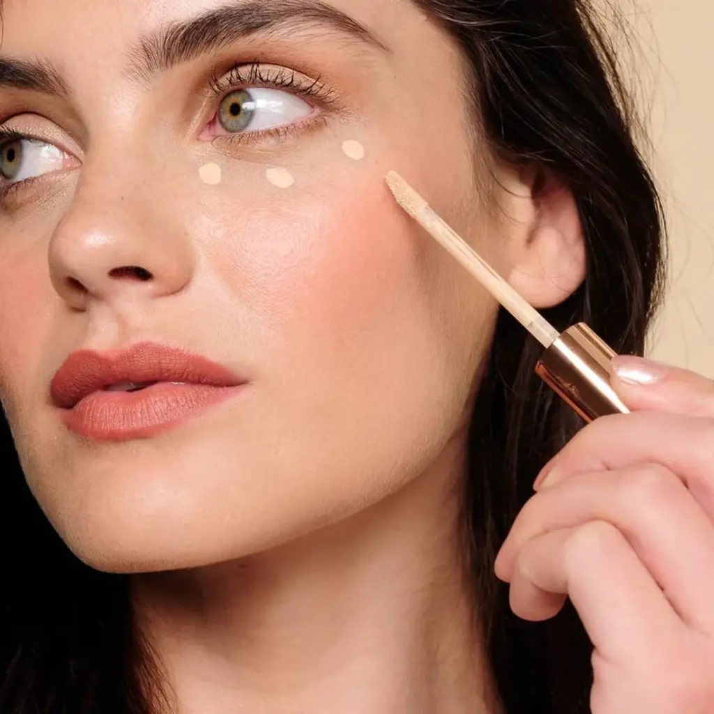 Close-up of concealer palette with various shades for skin tones.