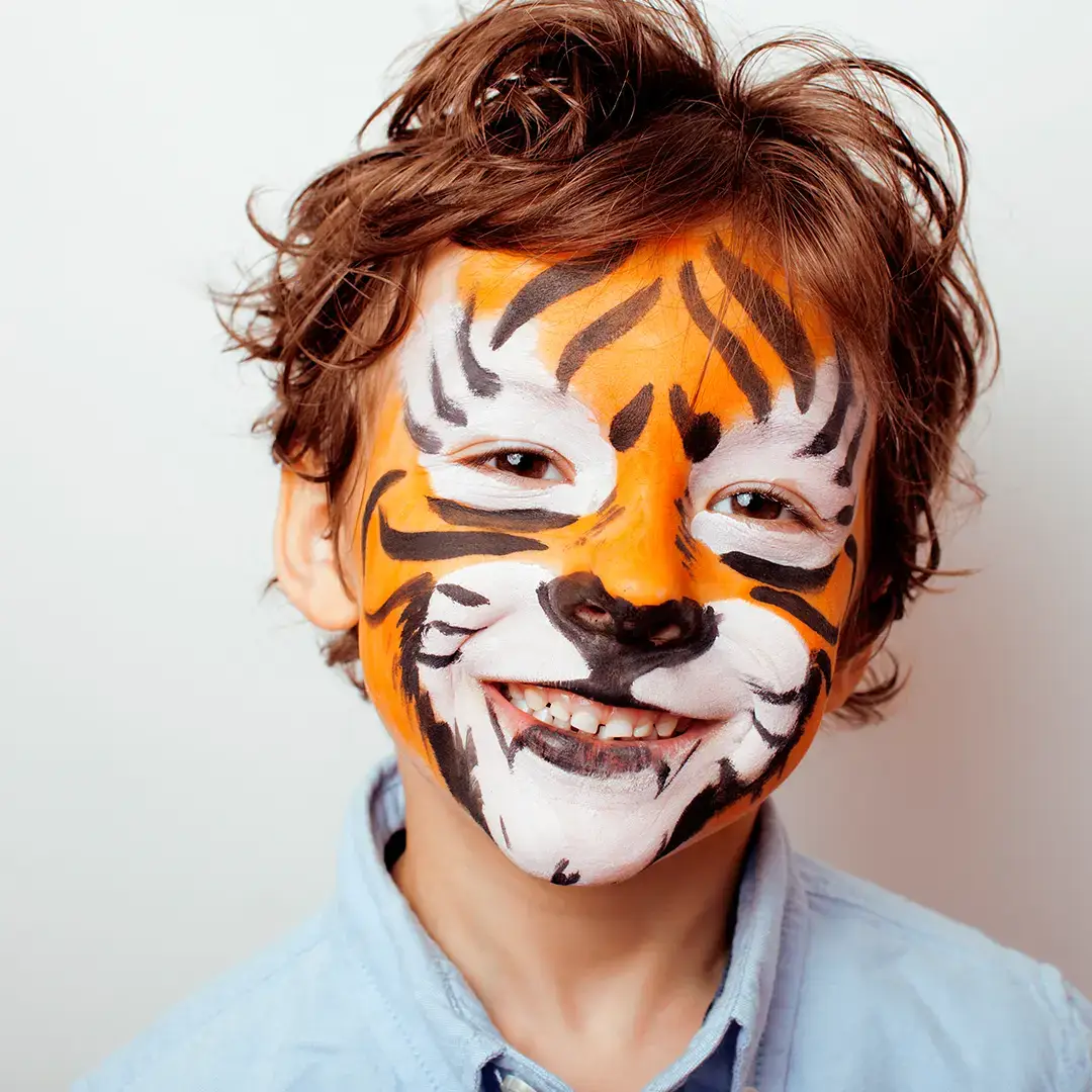 Colorful kids face paint palette with vibrant paintbrushes.