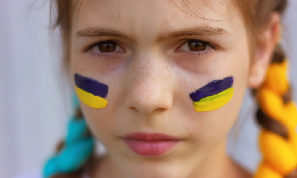 Professional athletes adorned with sport face paint before hitting the field.