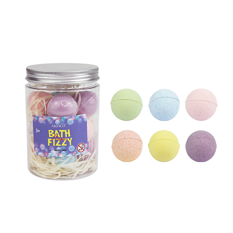 Colorful bath bombs for kids in a tub, creating fun and fizzy bubbles.