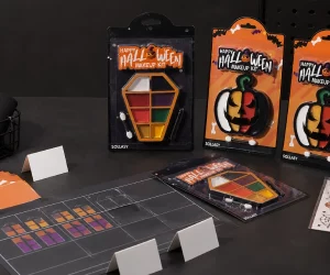 SOLLASY Halloween face-paint kits, fake-blood tubes, tattoo sheets, and assortment cards arranged for a seasonal retail review.