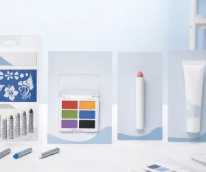 White-label children's face-paint crayons, palette, twist-up stick, and tube displayed side by side for a buyer comparison.